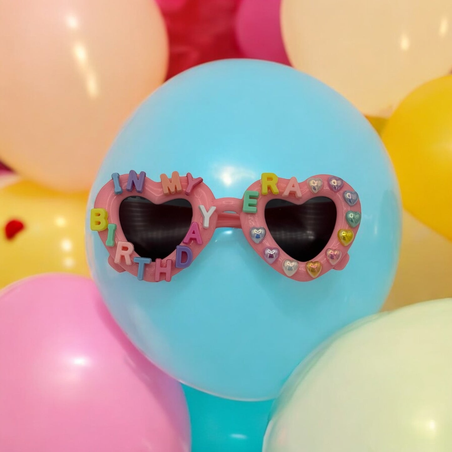 Pink heart sunglasses say in my birthday era in pastel