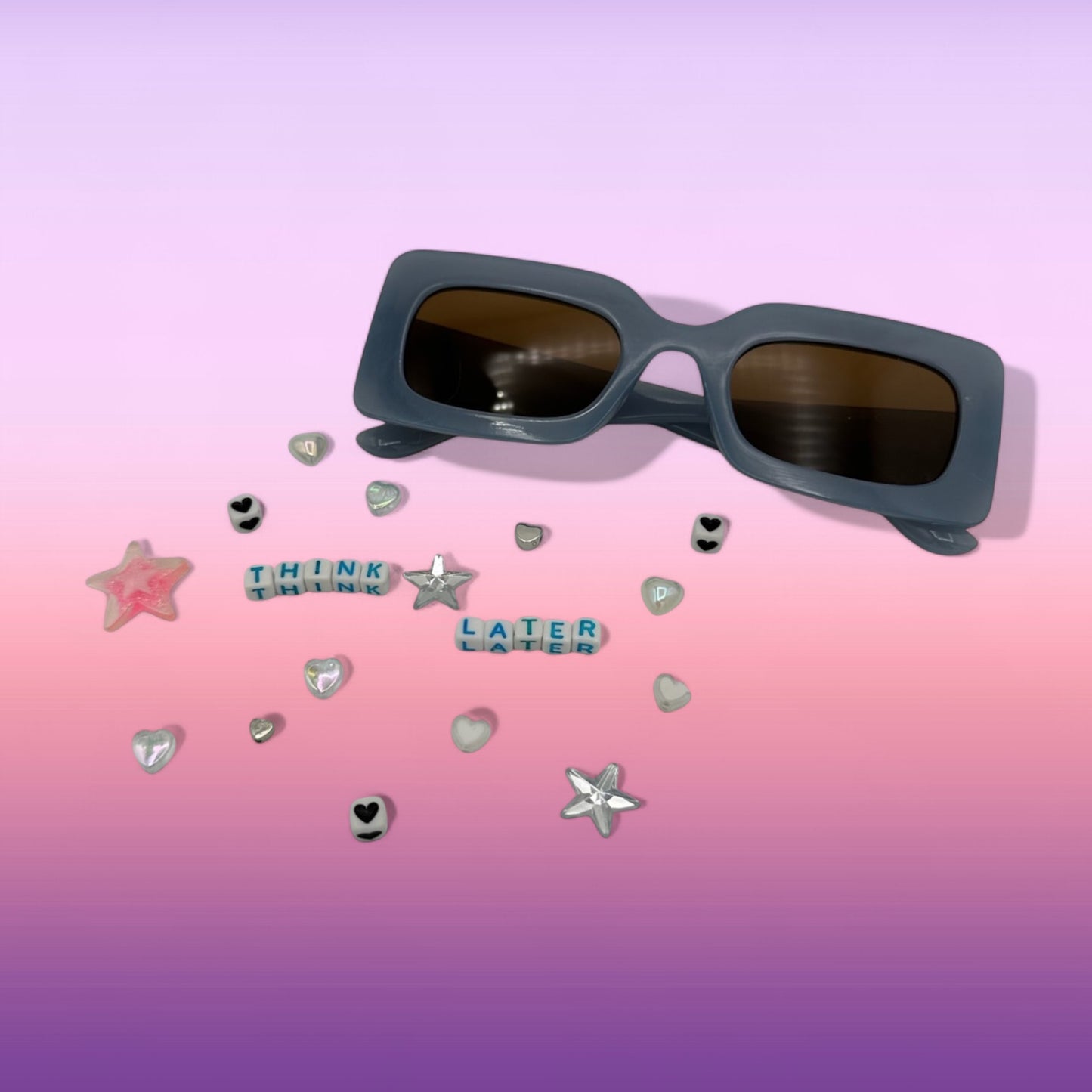 blue rectangle sunglasses shown with charms in kit