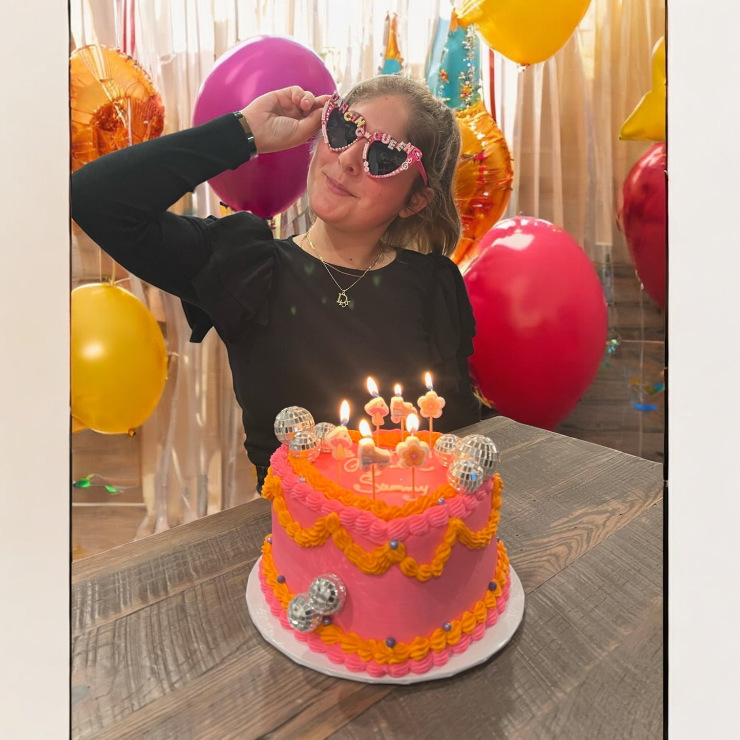 17 year old birthday girl with cake wearing heart sunglasses