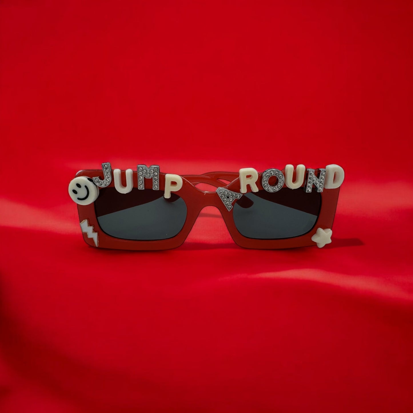 Red rectangle sunglasses jump around U Wisconsin