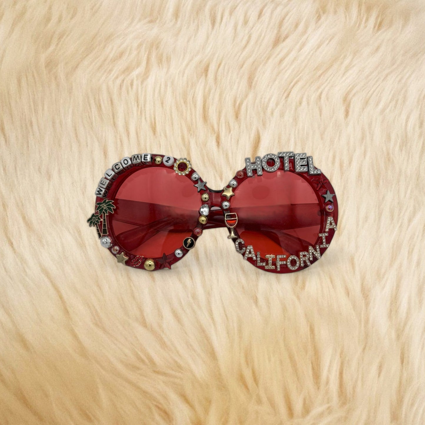Oversized red round sunglasses saying Hotel California