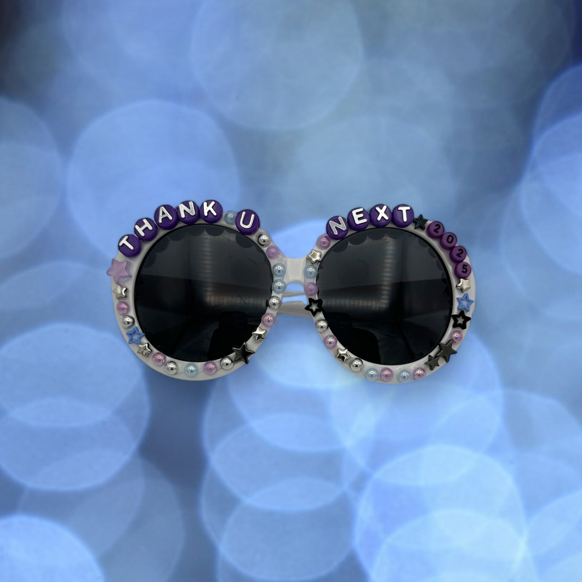 Round white sunglasses w purple charms and stars