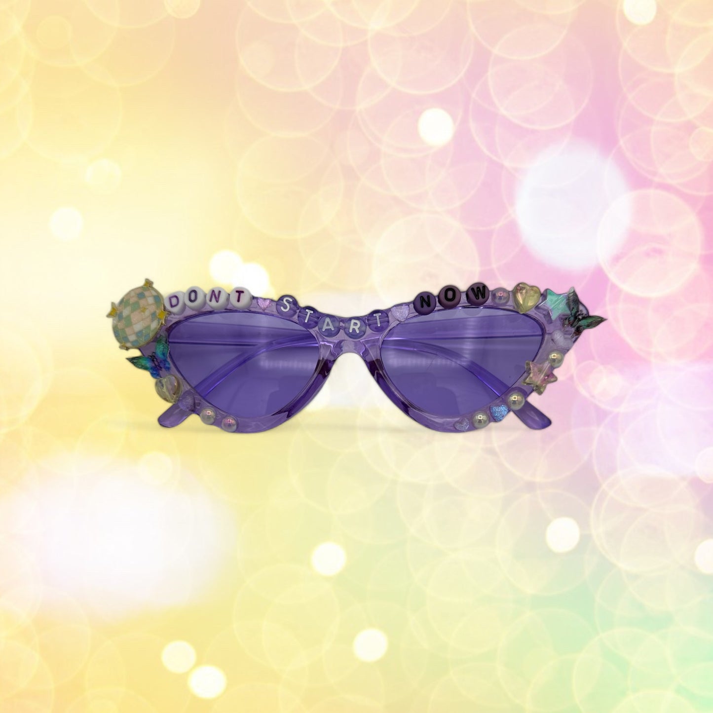 purple cat eye sunglasses with disco balls and butterflies