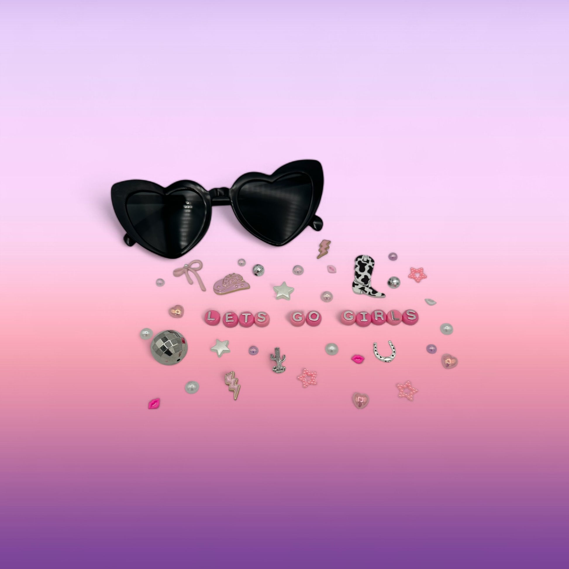 Black heart sunglasses shown with charms