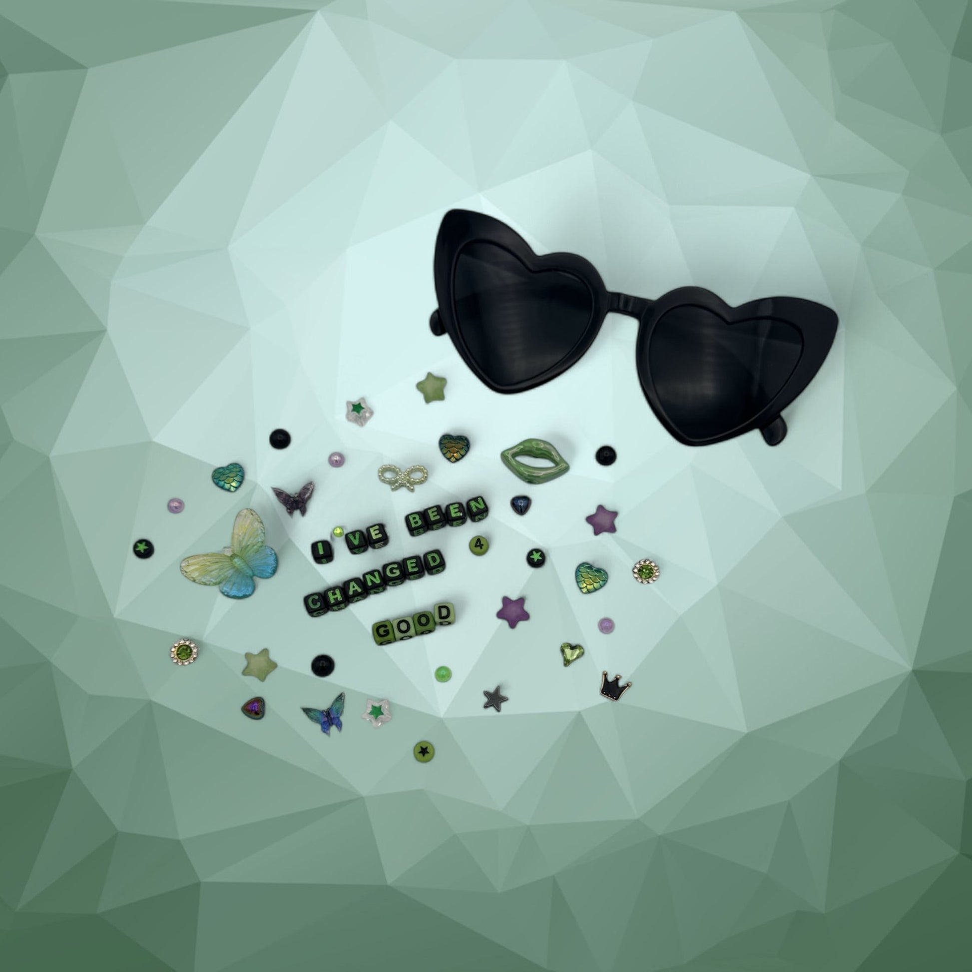 Black heart sunglasses shown with charms