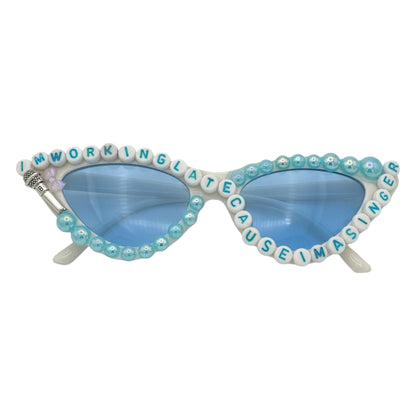 White cat eye sunglasses with blue lens blue accents