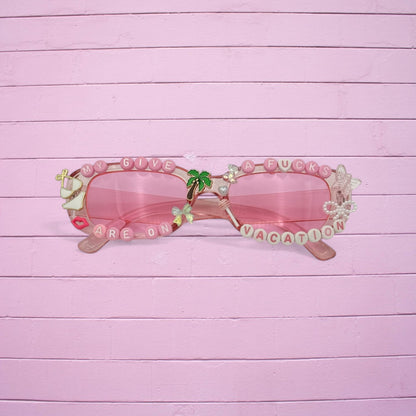 Narrow pink rectangle sunglasses w beach charms