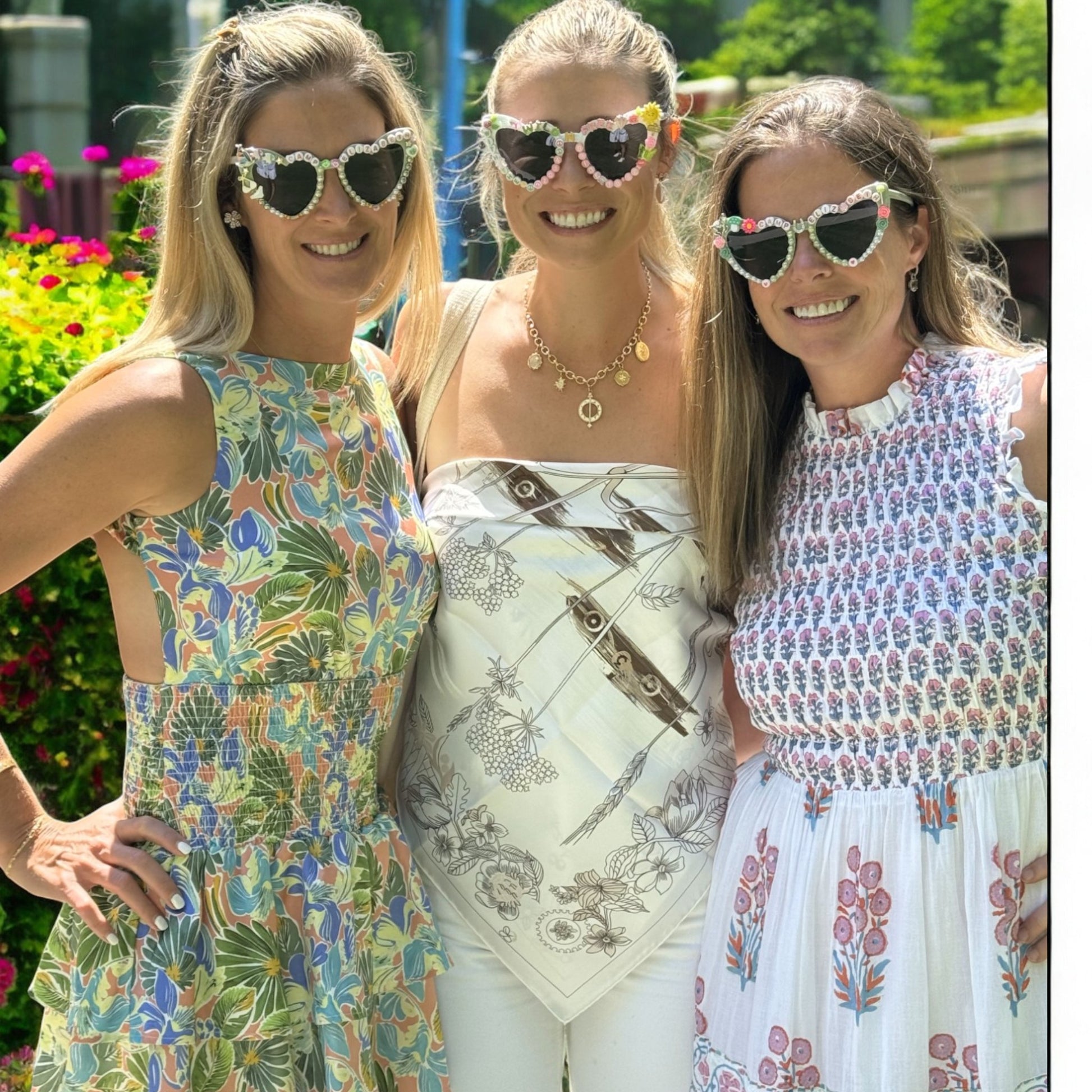 three women wearing camp bachelorette sunglasses