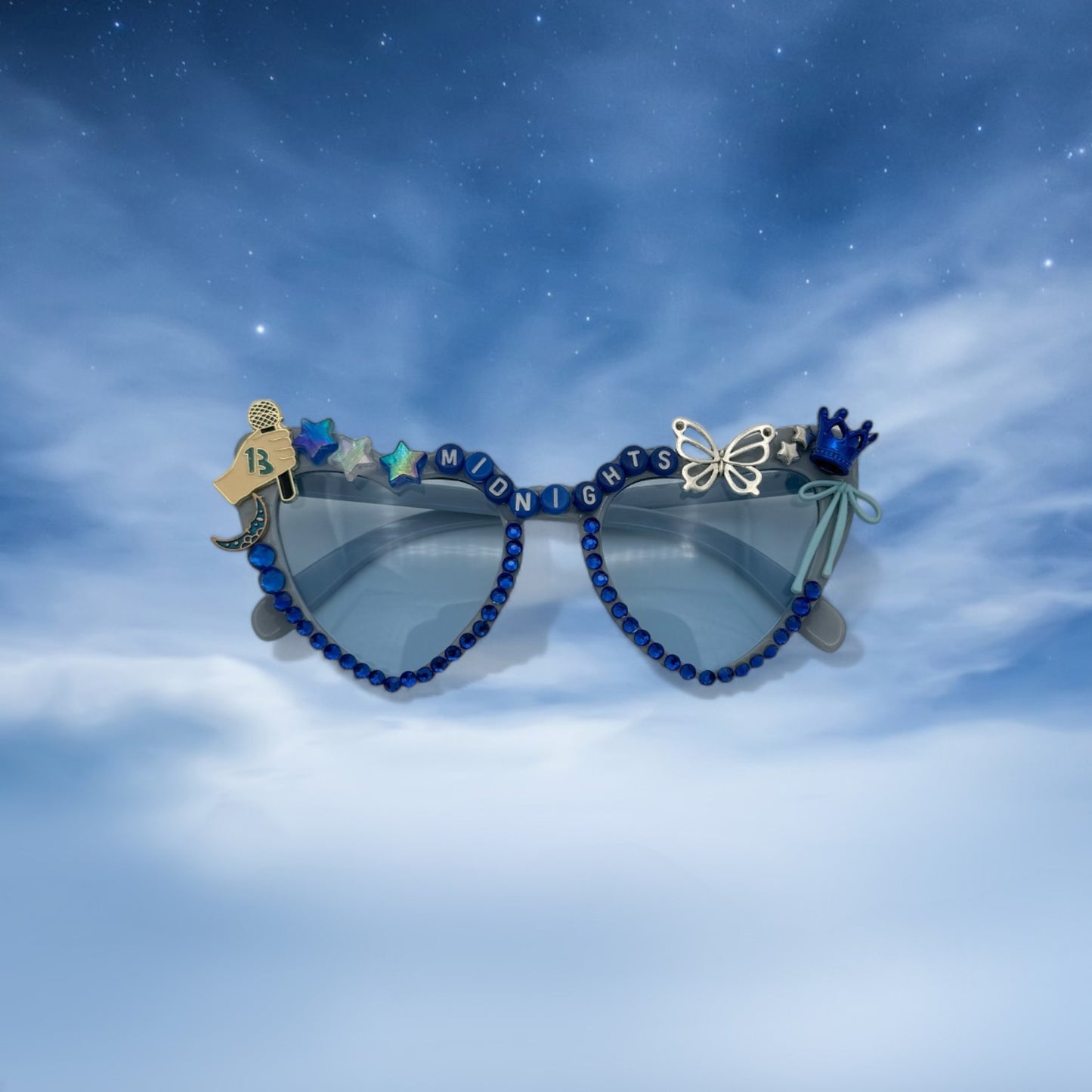 Blue heart sunglasses covered with silver and blue charms