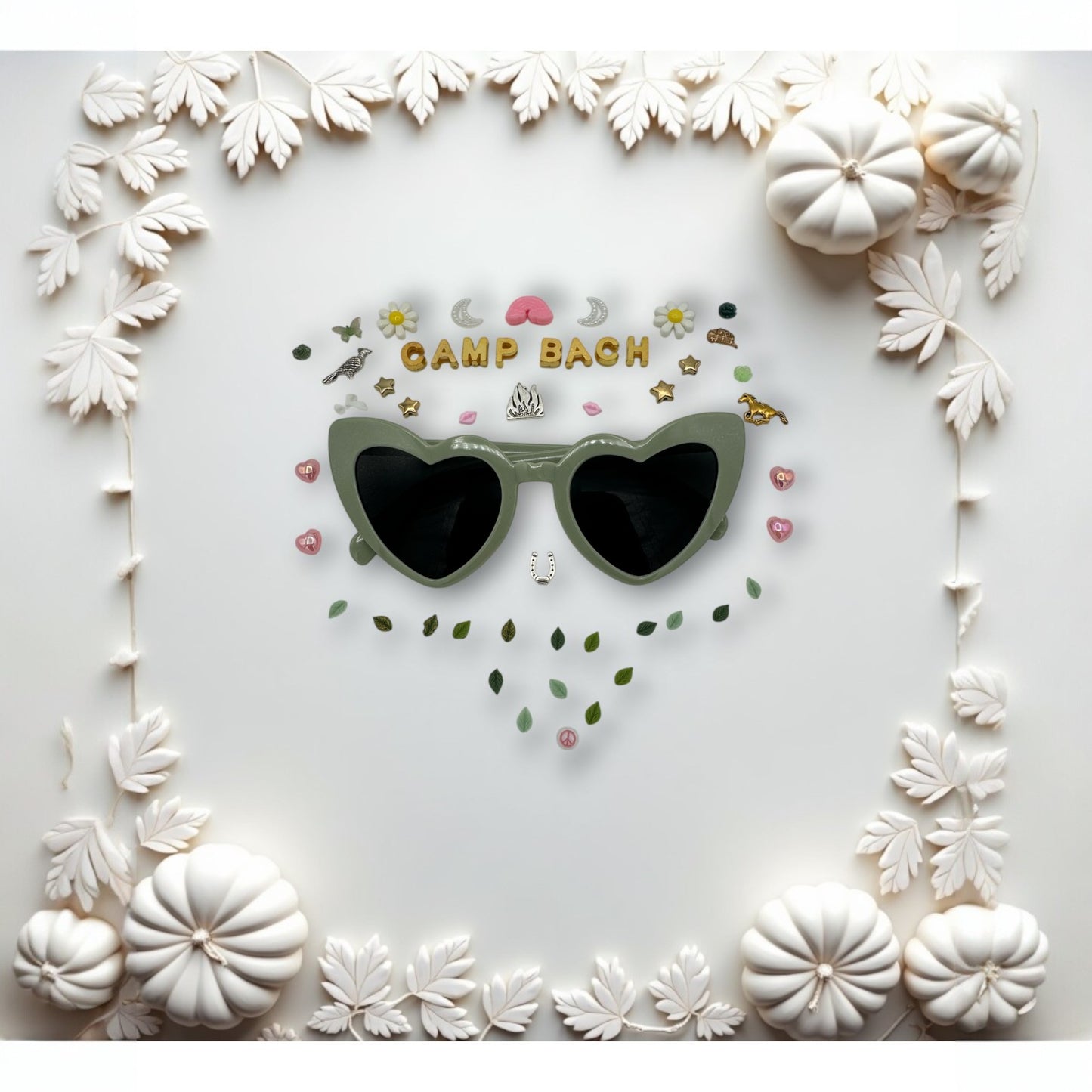 green heart sunglasses shown with charms around the frames