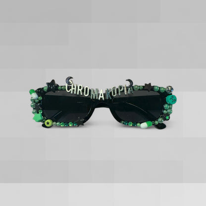 Black rectangle sunglasses with green and gold embellishment