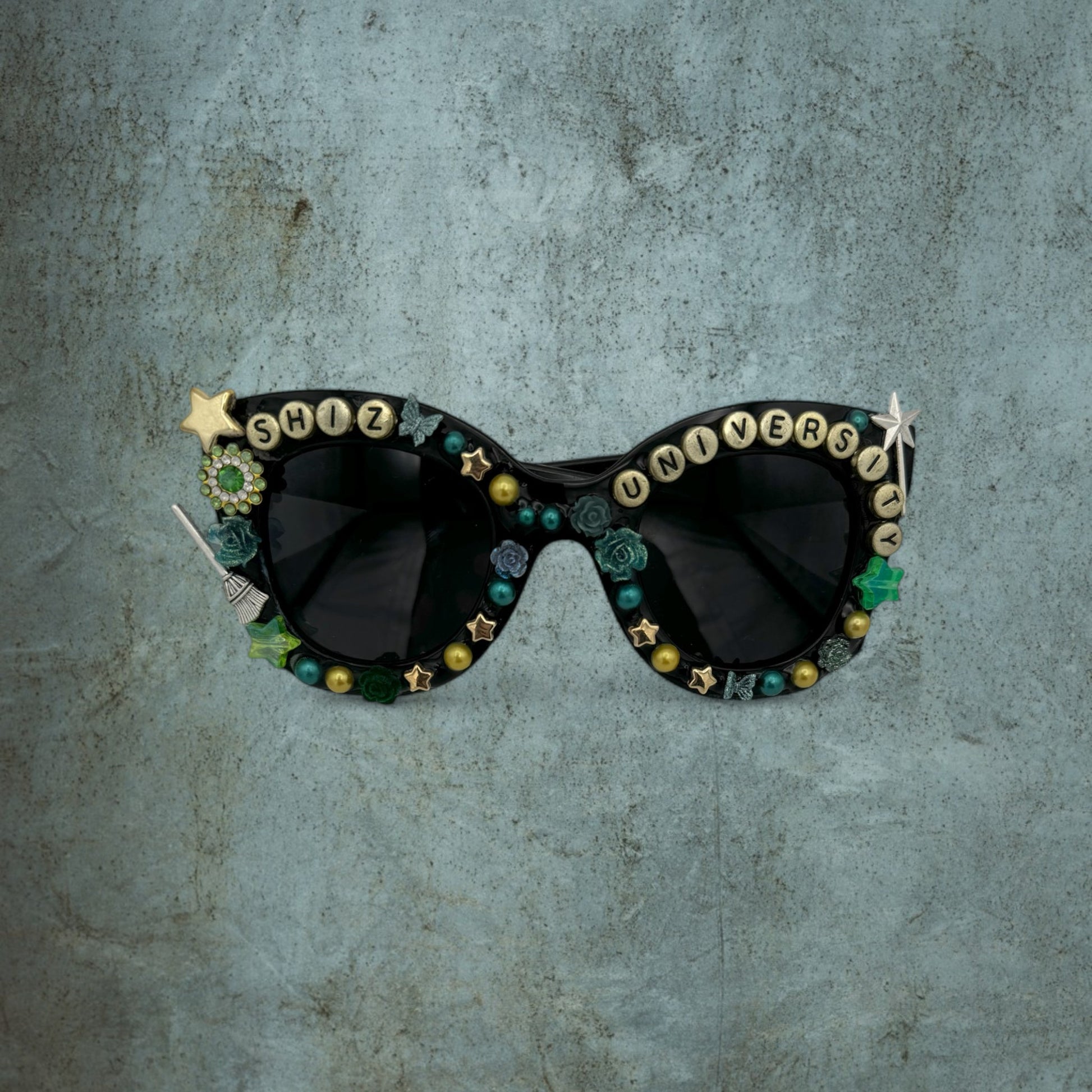 Black oversized cat eye sunglasses with gold charms