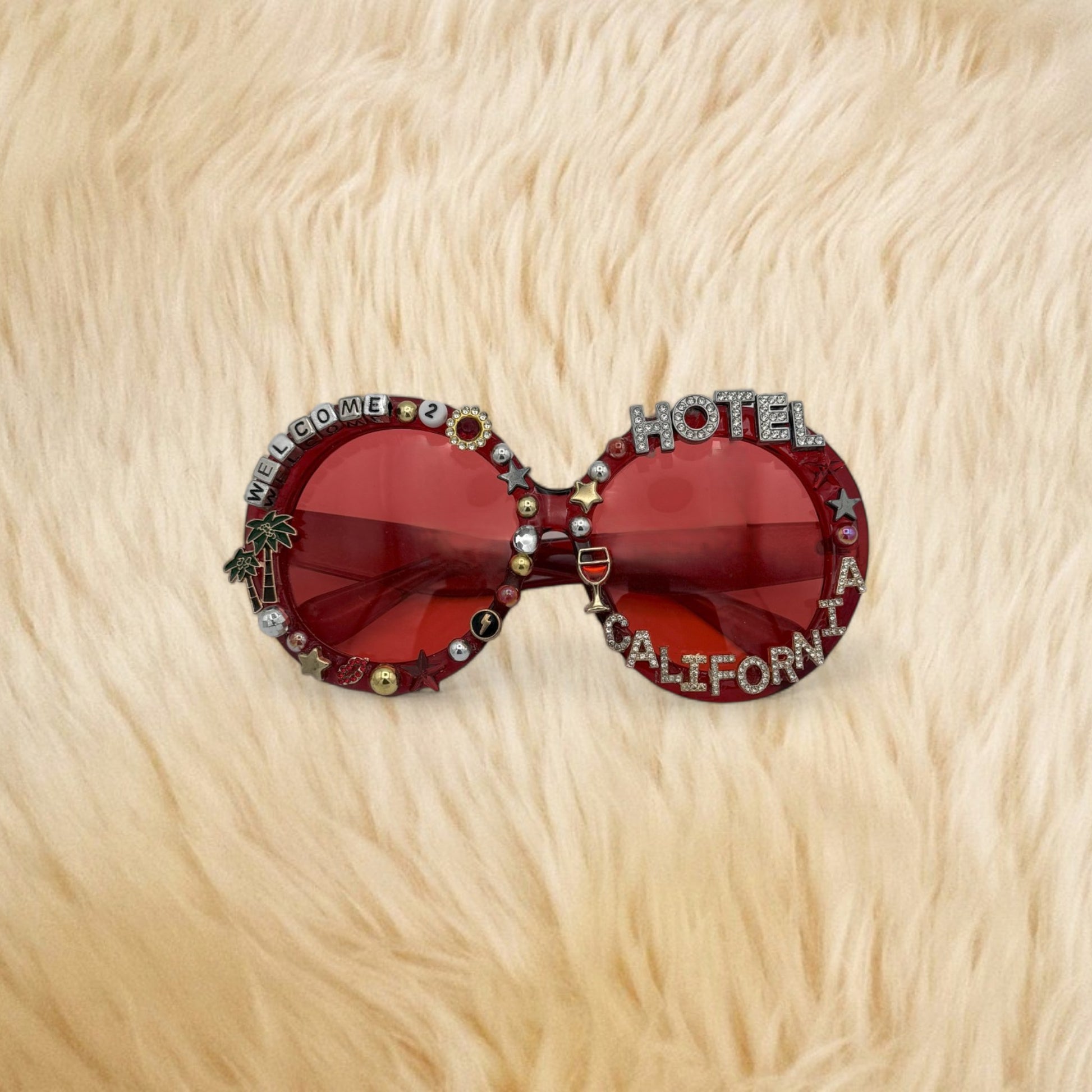 Oversized red round sunglasses saying Hotel California
