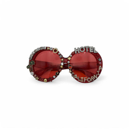 Oversized red round sunglasses saying Hotel California