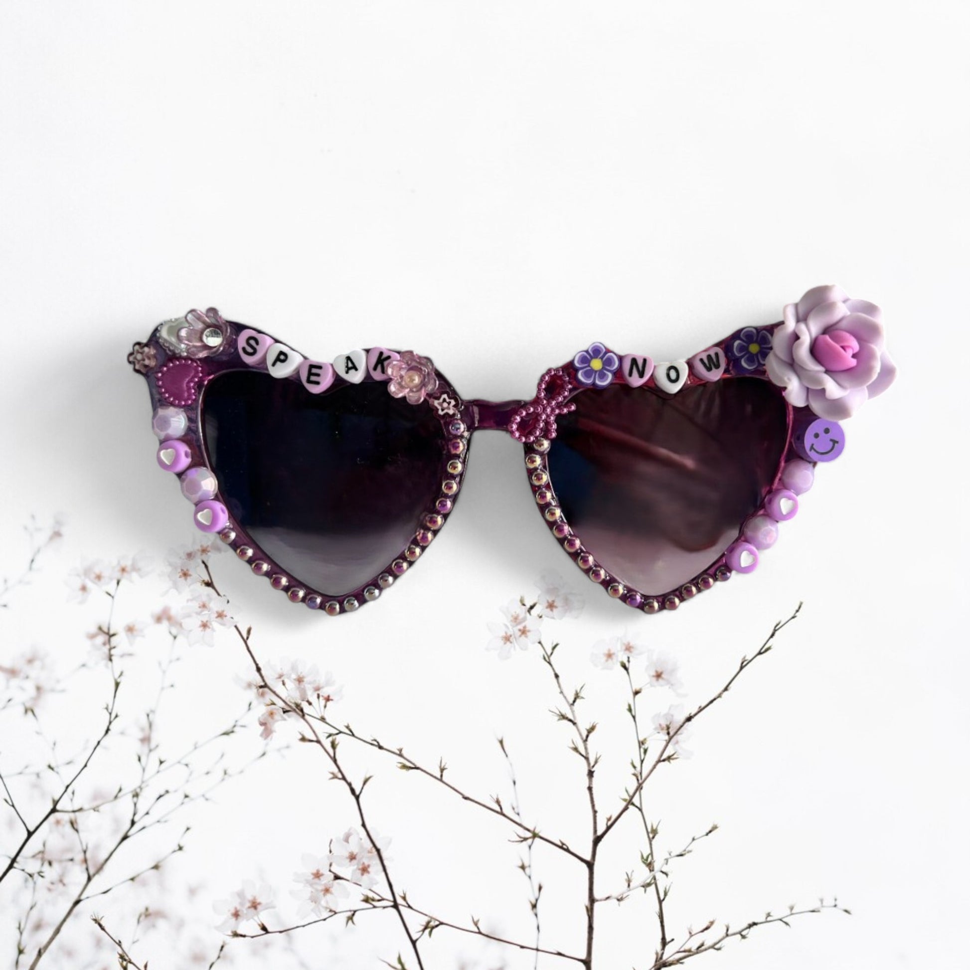 Purple sunglasses with roses and other purple charms