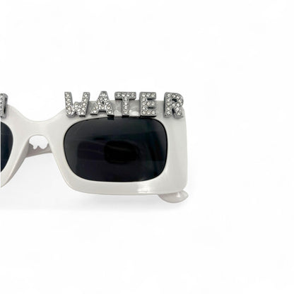Sunglasses with 'WATER' on the frame against a white background