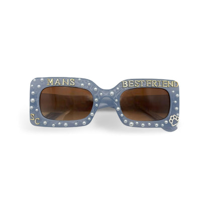 Sunglasses with 'Mans Best Friend' text on a white background