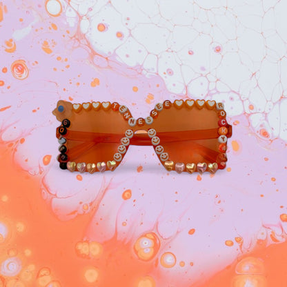 Tennessee orange sunglasses that say Rocky Top and Go Vols